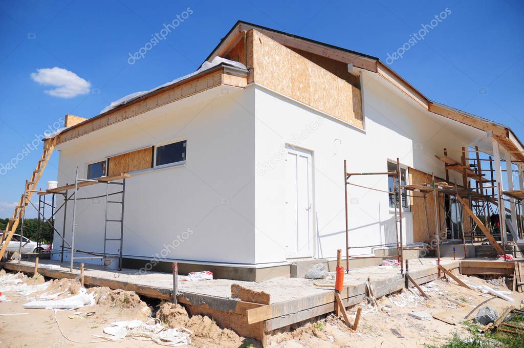 Unfinished house. Home Remodeling and Renovation. Painting house wal with stucco and plastering. Insulation House and Old House Renovation.