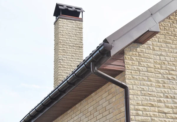 Metal roof with rain gutter pipeline system and holders.