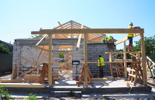 Roofers Building Wood Trusses Roof Frame House Construction.