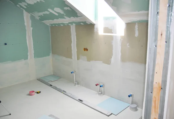 Remodeling attic bathroom with  drywall repair, plastering and painting walls