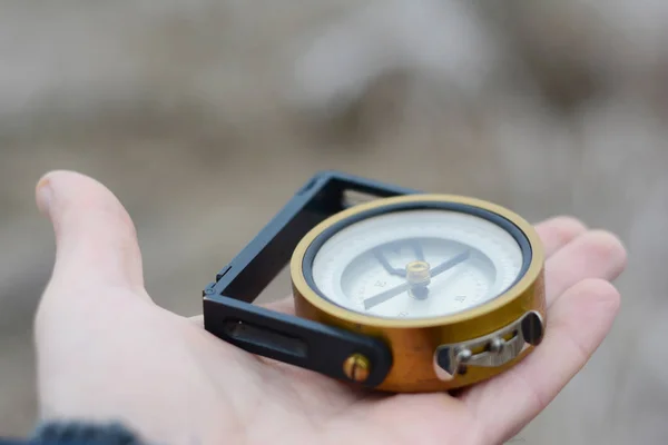 Compass in hand. Student make choice in his future, life direction to success. — Stock Photo, Image