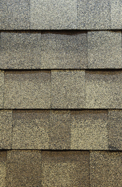 Close up on Asphalt shingles for roofing construction.