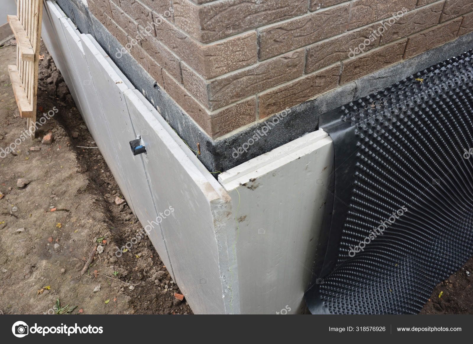 Foundation insulation and Damp proofing in problem corner area. House