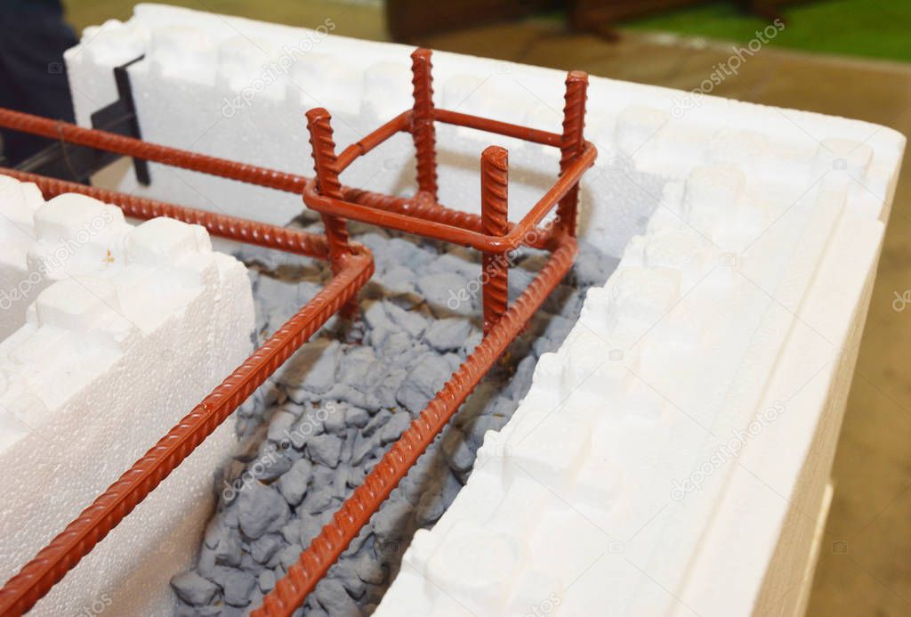 Insulating concrete forms ICF  with metal reinforced concrete house walls. Insulating concrete forms ICF made of plastic foam that construction crews stack into the shape of the walls of a building.