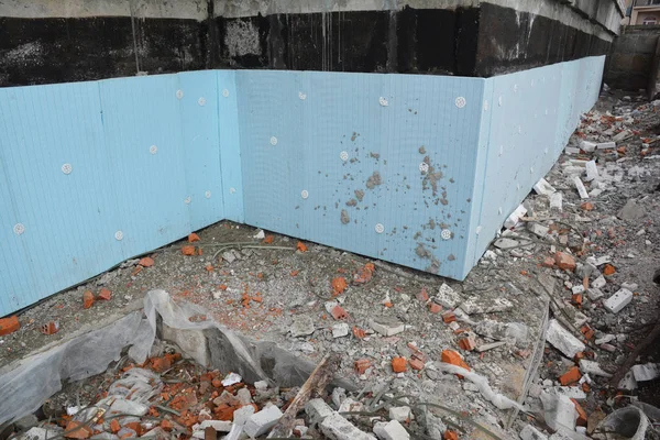 Expanded Polystyrene (EPS) foam board house foundation wall insulation.  House foundation waterproofing and insulation