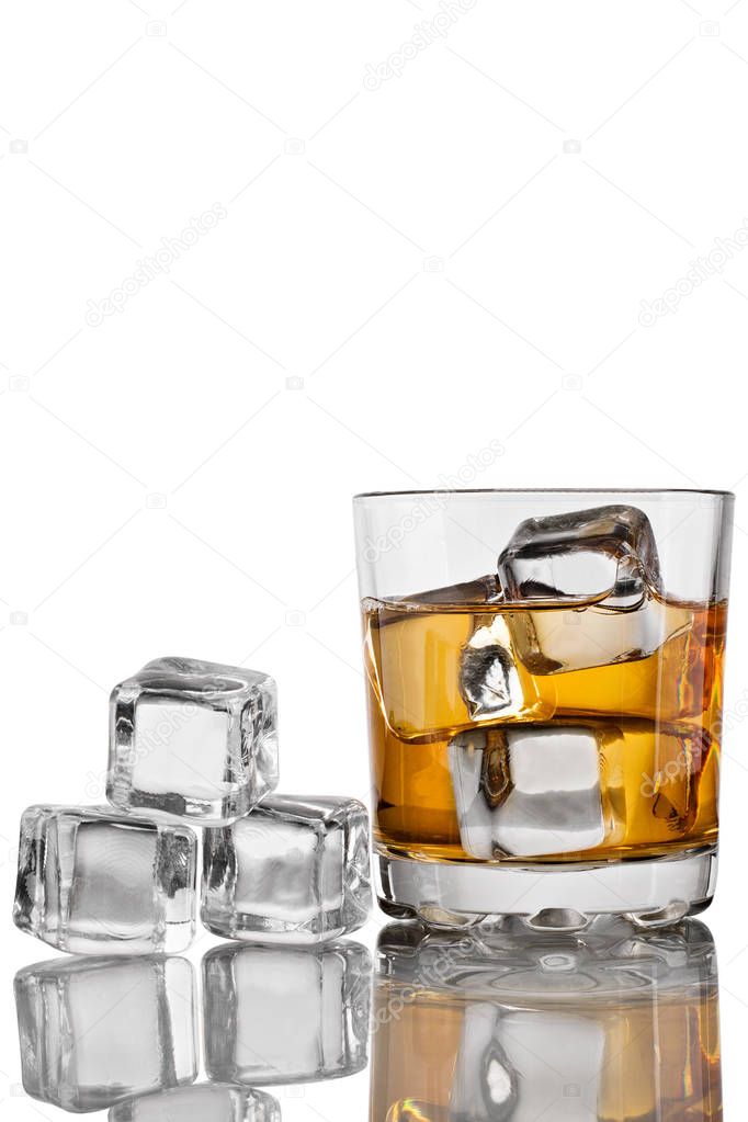Glass of whiskey with ice on a white background