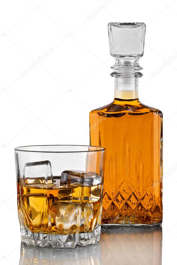 Decanter, a glass of whiskey with ice on a white background with reflection