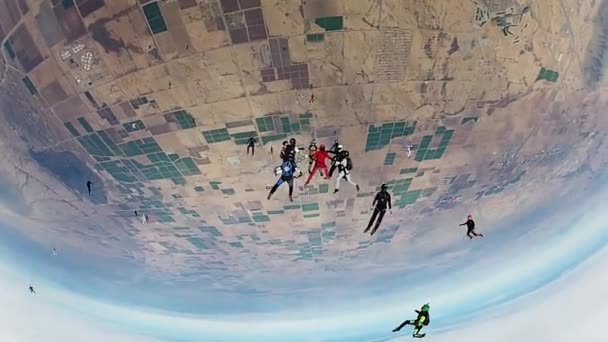 Team of skydivers making formation in sky. Height. Extreme sport. Stunt. — Stock Video