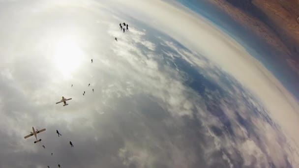 Team of skydivers making formation in sky. Height. Extreme activity. Stunt. — Stock Video
