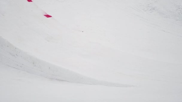 SOCHI, RUSSIA - APRIL 4, 2016: Skier jump from springboard, make flip in air. Ski resort. Extreme stunt. — Stock Video