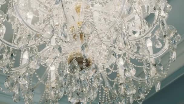 Close up tracking shot expensive old style glass diamonds chandelier — Stock Video