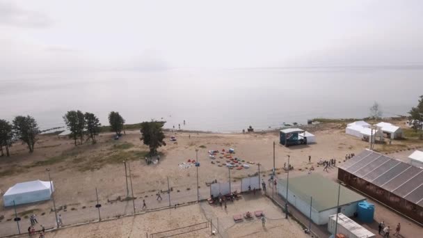 SAINT PETERSBURG, RUSSIA - JULY 30, 2016: Aerial shot sandy beach by seaside with beanbags and sports ground in summertime — Stock Video