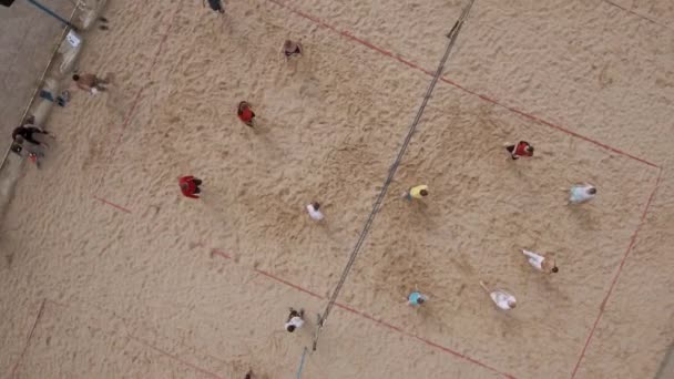 SAINT PETERSBURG, RUSSIA - JULY 30, 2016: Aerial shot players compete beach volleyball at sand sports ground on sunny day — Stock Video