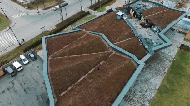 Aerial view of modern architect building roof covered in soil and grass — Stock Video