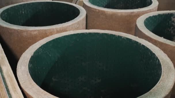 New concrete manholes with green plastic inside at factory repository place — Stock Video