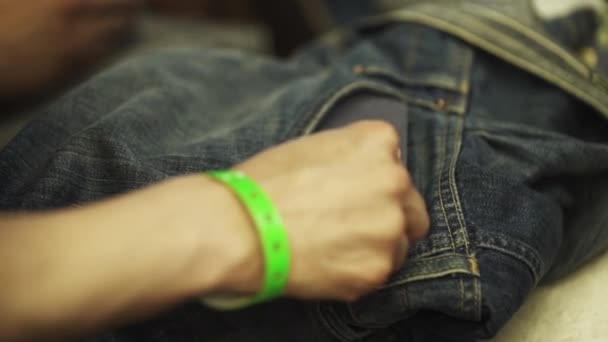 Man and woman tailor hands working with denim jeans in workshop — Stock Video