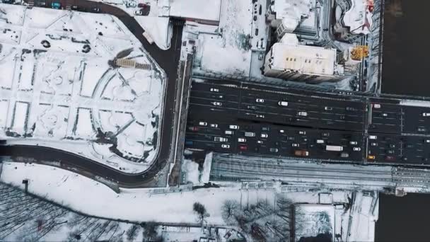 Aerial top view car road city traffic near living houses area cvered in snow — Stock Video