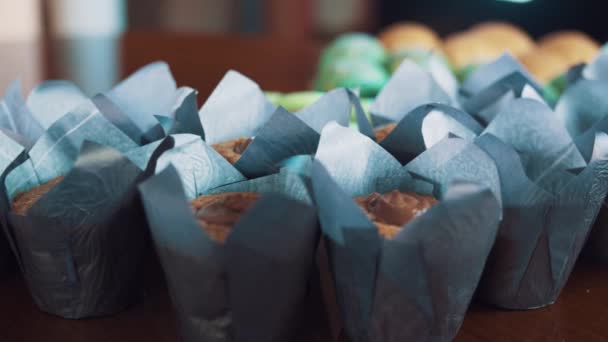 Sweet colorful baking food on kitchen table — Stock Video