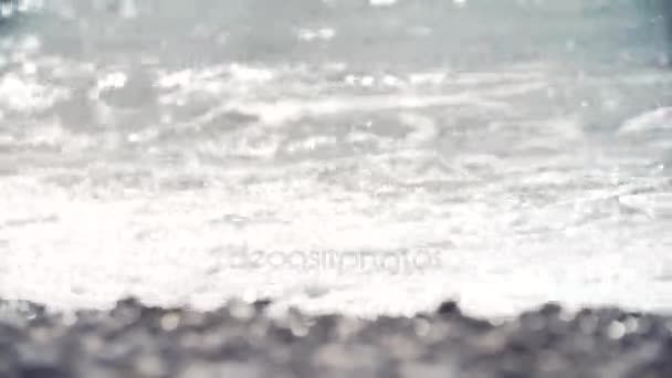 Sea water waves blows on shore covered in pebble stones — Stock Video
