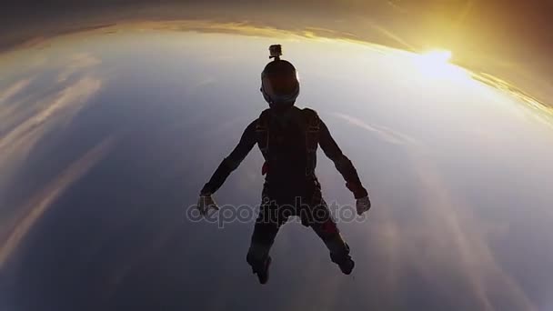 Professional skydivers in uniform free falling in sky. Open parachute. Sunset. — Stock Video