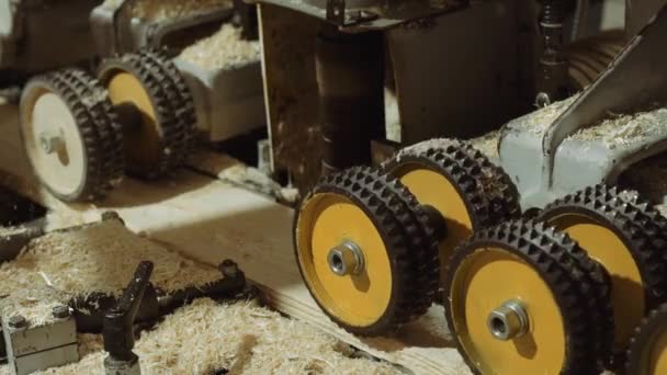 Rolling wheels of board refiner machine at sawmill production — Stock Video