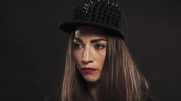 Young pretty woman in spiked snapback cap portrait — Stock Video