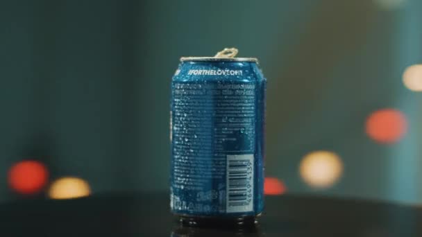 SAINT PETERSBURG, RUSSIA - NOVEMBER 23, 2019: Blue PEPSI can with condensation droplets on surface is placed on round table. — Stock Video