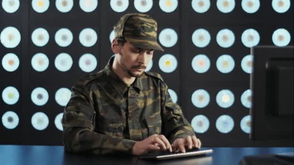 Bearded Mature Man Wearing Military Camouflage Clothes Cap Sits Desk — Stock Video