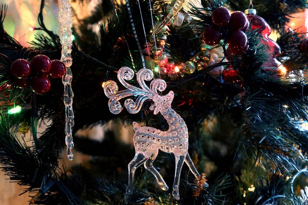 Decorations and festive toys on the christmas tree — Stock Photo, Image