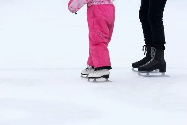 Foot skating girls and women on an ice rink — Stock Photo, Image