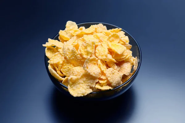 Yellow corn flakes in a bow — Stock Photo, Image