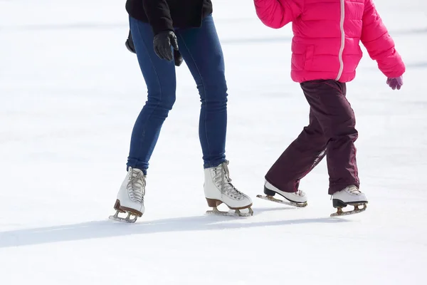 Feet skating on the ice rink — Stock Photo, Image
