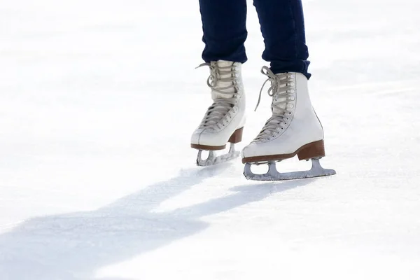 Feet skating on the ice rink — Stock Photo, Image