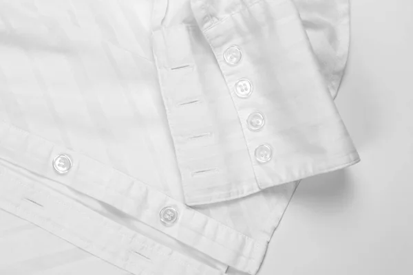 Λευκό μακρυμάνικο πουκάμισο με κουμπιά closeup — Φωτογραφία Αρχείου