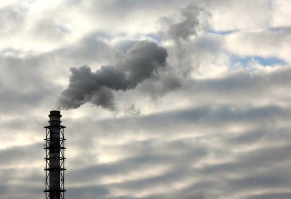 the smoke from the chimney of an industrial enterprise in the sky