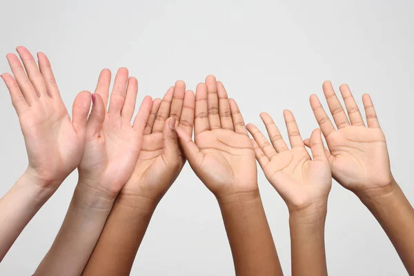 Many raised hands in a row — Stock Photo, Image