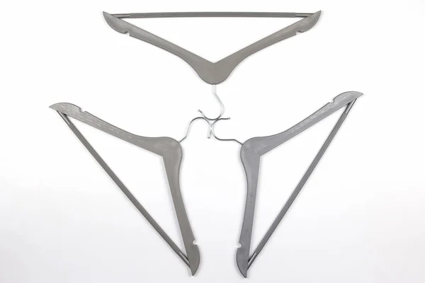 Set of gray clothes hangers on a white background — Stock Photo, Image