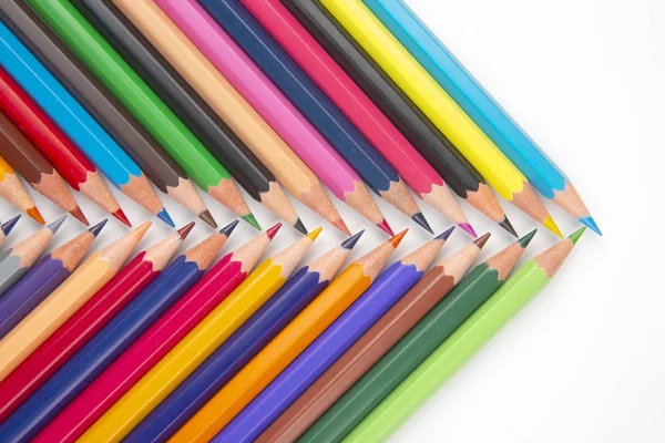 Colored pencils for drawing on a white background. Education and — Stock Photo, Image