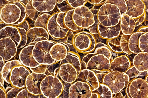Large number of dried lemon slices. vitamin fruit food — Stockfoto