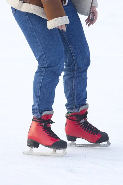 Girl ice skating on an ice rink. Hobbies and sports. Vacations a — Stock Photo, Image