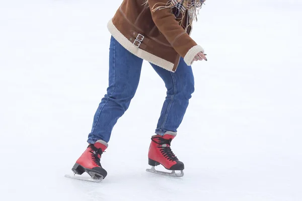 Girl ice skating on an ice rink. Hobbies and sports. Vacations a — Stock Photo, Image