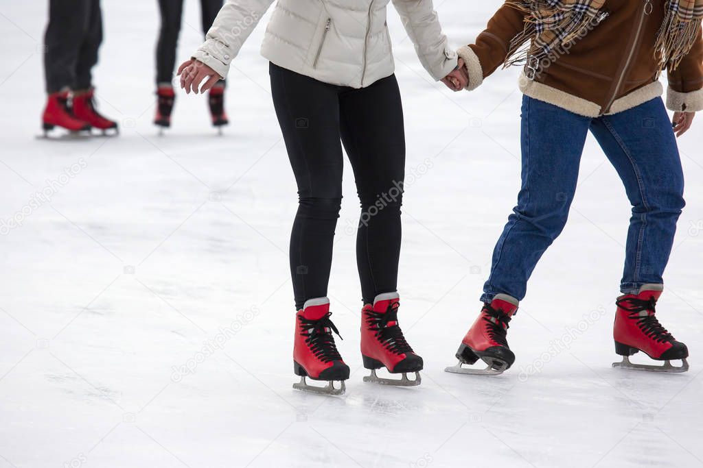 people ice skating on an ice rink. Hobbies and sports. Vacations