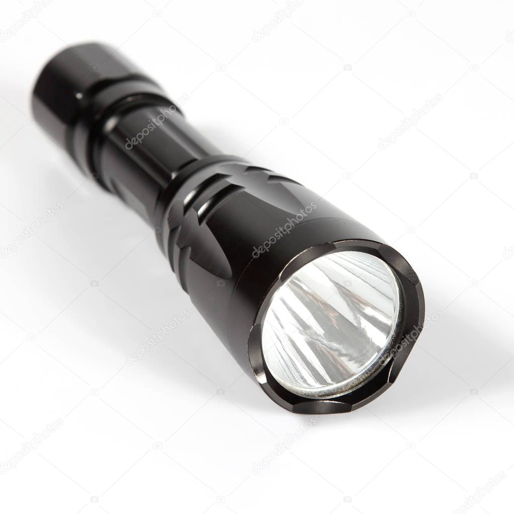 black flashlight on white background