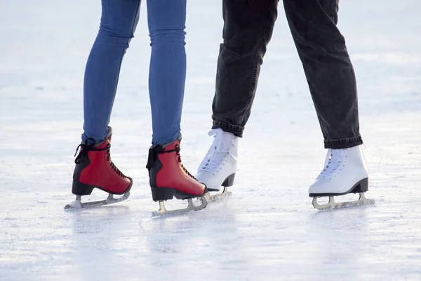 People ice skating on an ice rink. hobbies and leisure. winter s — Stock Photo, Image