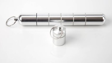 sealed aluminum containers for small items and medical pills on 