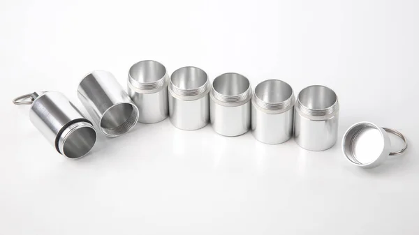 sealed aluminum containers for small items and medical pills on