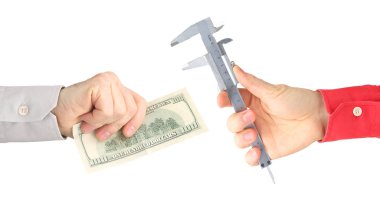 hands with work tool and money on a white background. salary. bu