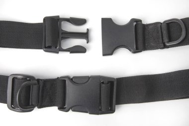 black plastic Fastex clip for backpacks on a white background. i