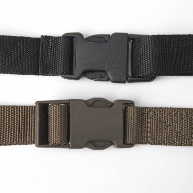 black plastic Fastex clip for backpacks on a white background. i