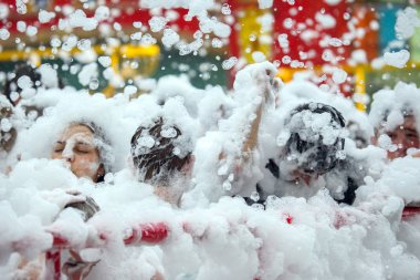 People dancing at the foam party
